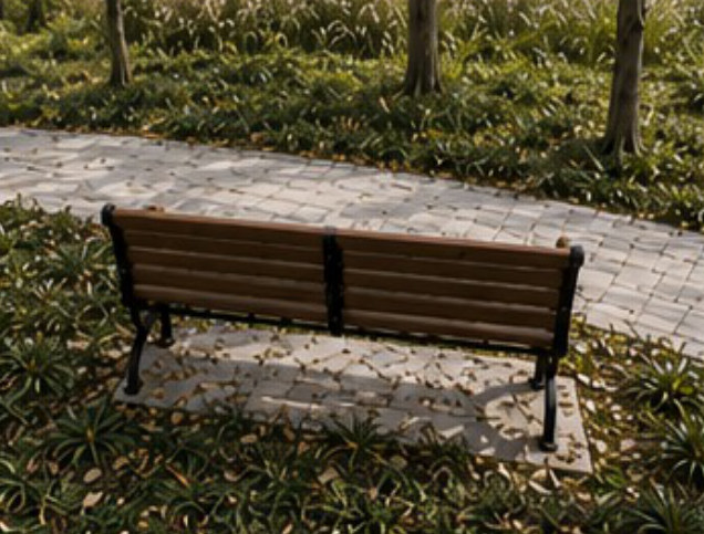 View 3 of the park, bench in front and road behind.